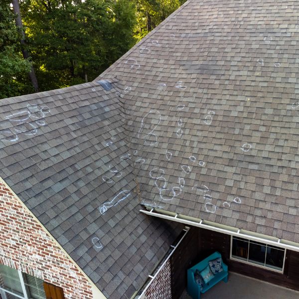 Roof damage from storm showing need for roof insurance claim assistance