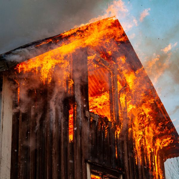 Home damaged by fire representing the need for insurance claim assistance